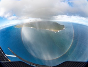 Circle Rainbow from Helicopter   Molokai Island in back    credit   Steven Businger